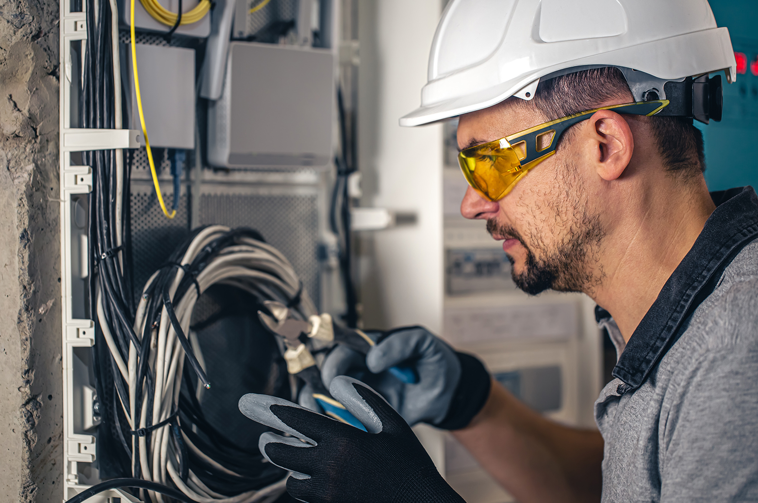 man-electrical-technician-working-switchboard-with-fuses